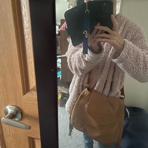 Brown crossover purse with fringe on the sides